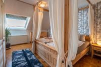 master bedroom with attic window